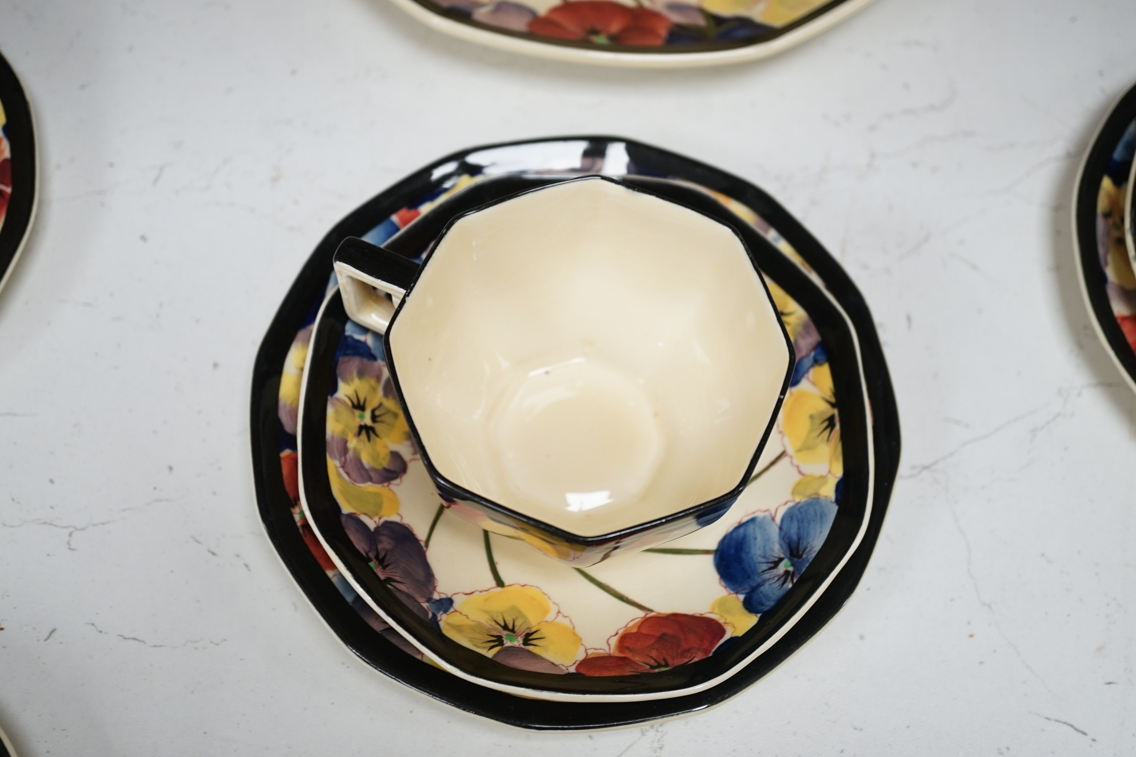 A Doulton “pansy” design tea set, marked on base D4049, Reg no:597783